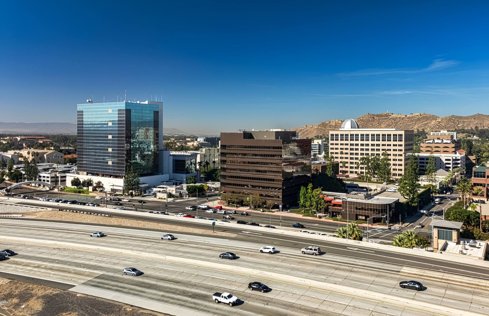 City skyline with office buildings and streets.
