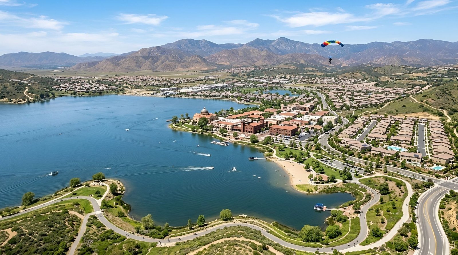 Lakefront neighborhood with homes and mountain views.